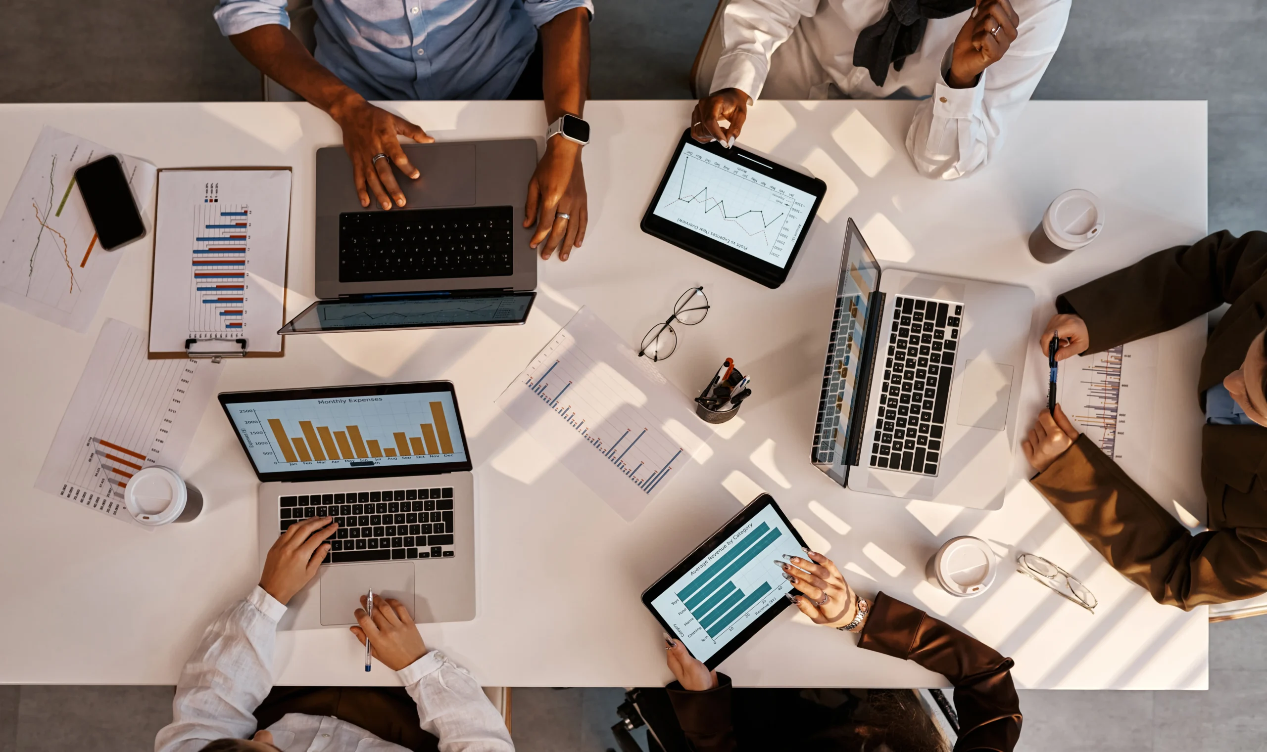 Marketing and IT leaders analyzing CRM performance data to address CRM adoption barriers and implementation challenges.